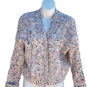 Cardigan, cream with colored specks throughout.